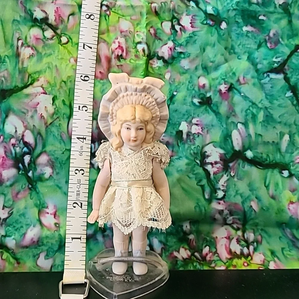 Vintage porcelain doll w/stand